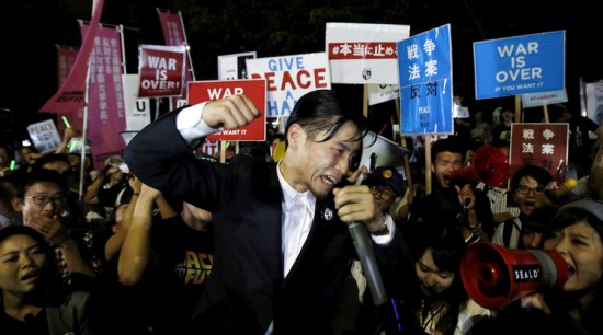 Okuda, founding member of the protest group Students Emergency Action for Liberal Democracy, shouts slogans during a rally against Japan's Prime Minister Shinzo Abe's security bill and his administration in front of the parliament in Tokyo