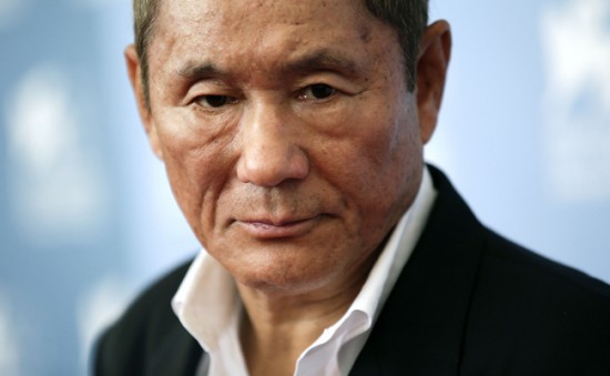 Japanese director Kitano poses during the photocall of the movie "Outrage Beyond" at the 69th Venice Film Festival