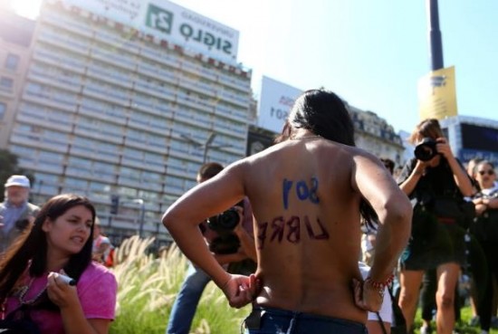 a-woman-poses-topless-during-a-protest-in-buenos-aires__162178_