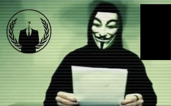 Still image taken from video released on social media shows a man wearing a mask associated with Anonymous making a statement